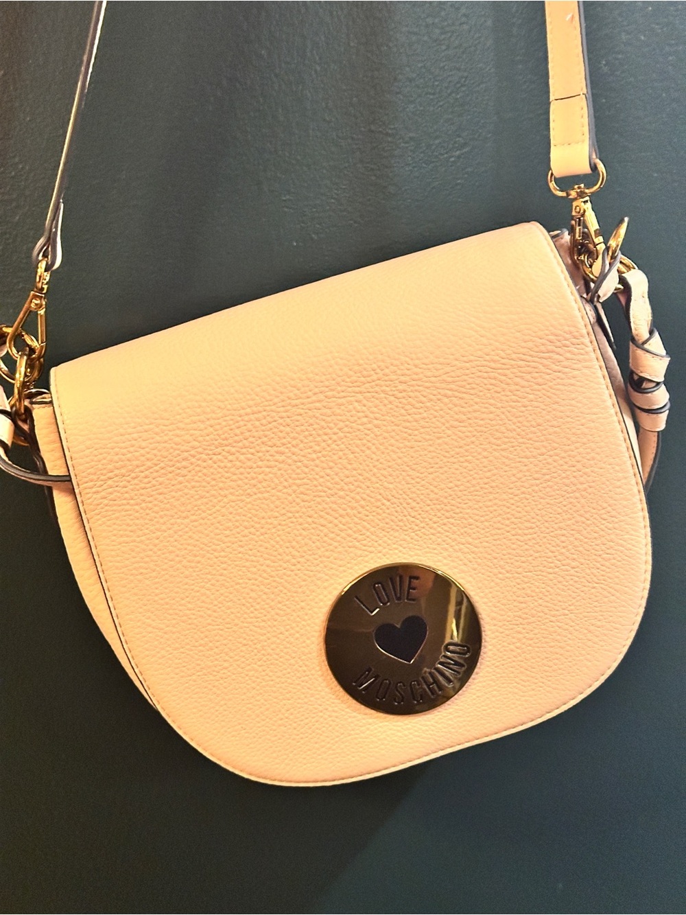 Love Moschino Cream Pebbled Leather Shoulder Saddle Bag with Gold Medallion